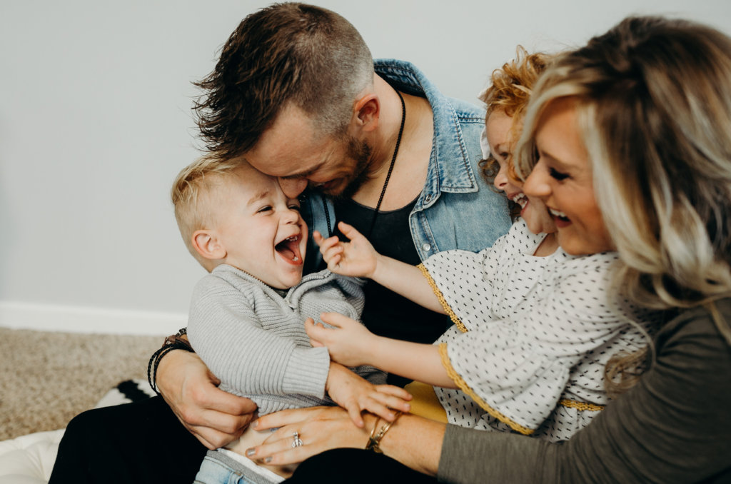 Happy Family Laughing Together